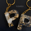 Schlüsselanhänger mit Goldpartikel P - T