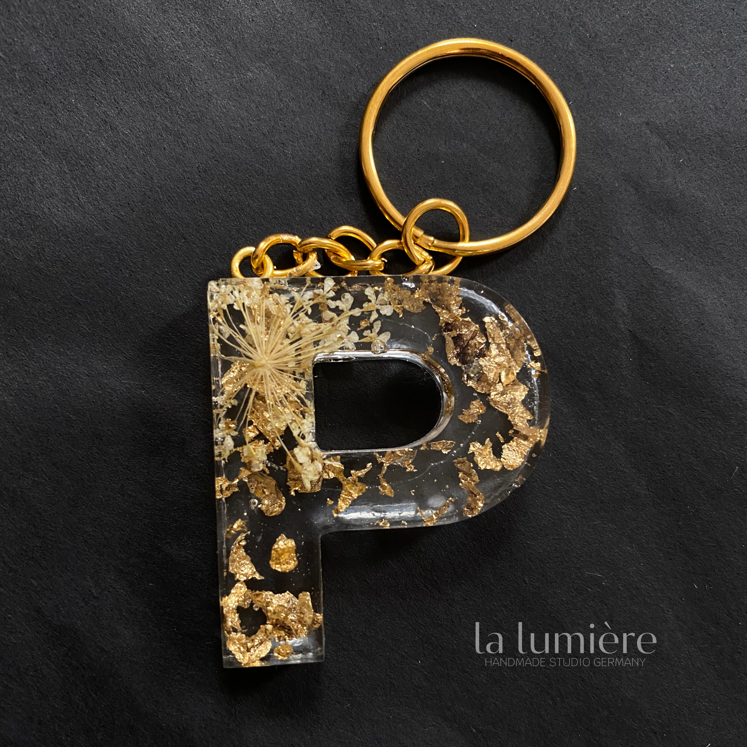 Schlüsselanhänger mit Goldpartikel P - T