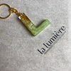 Schlüsselanhänger mit Goldpartikel P - T